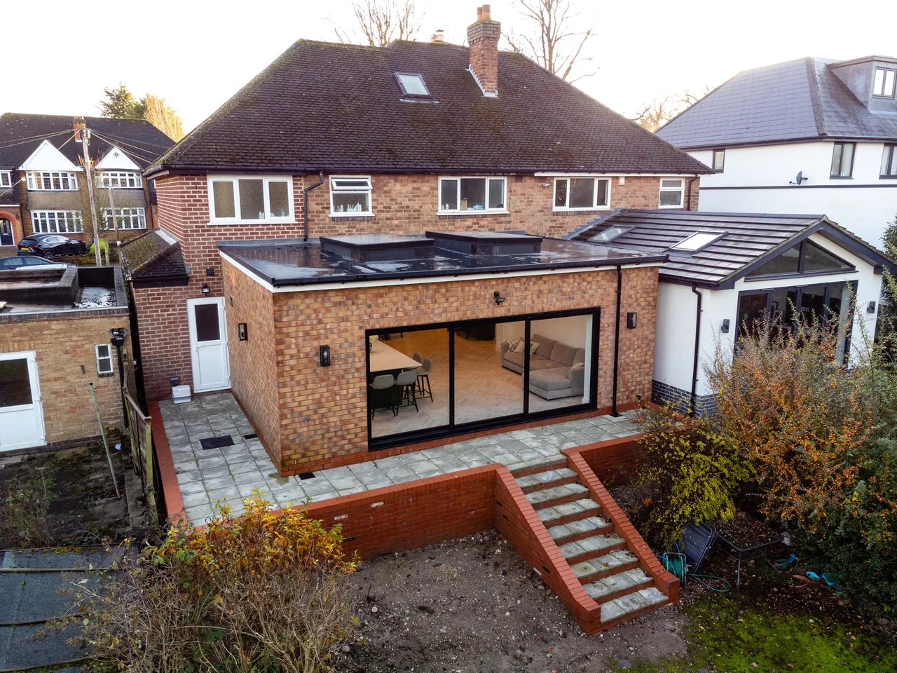 Aerial view of a completed rear extension to a large detached house