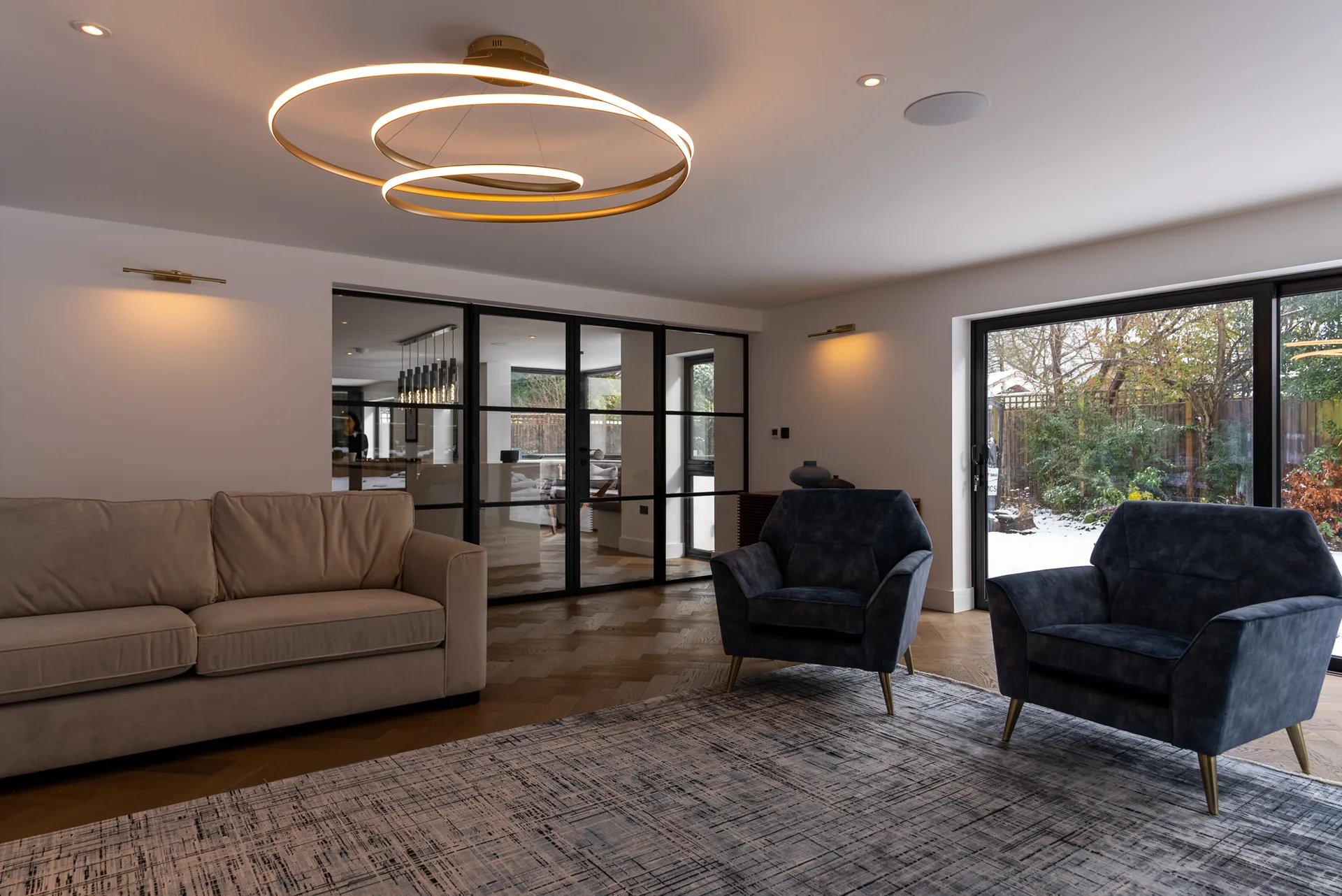 A finished open-plan living space with integrated lighting
