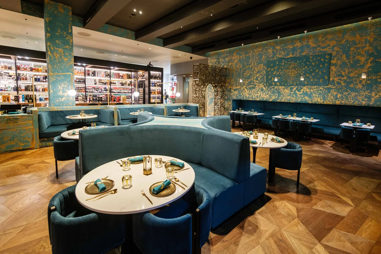 A retail interior during fit-out with the lighting scheme being installed